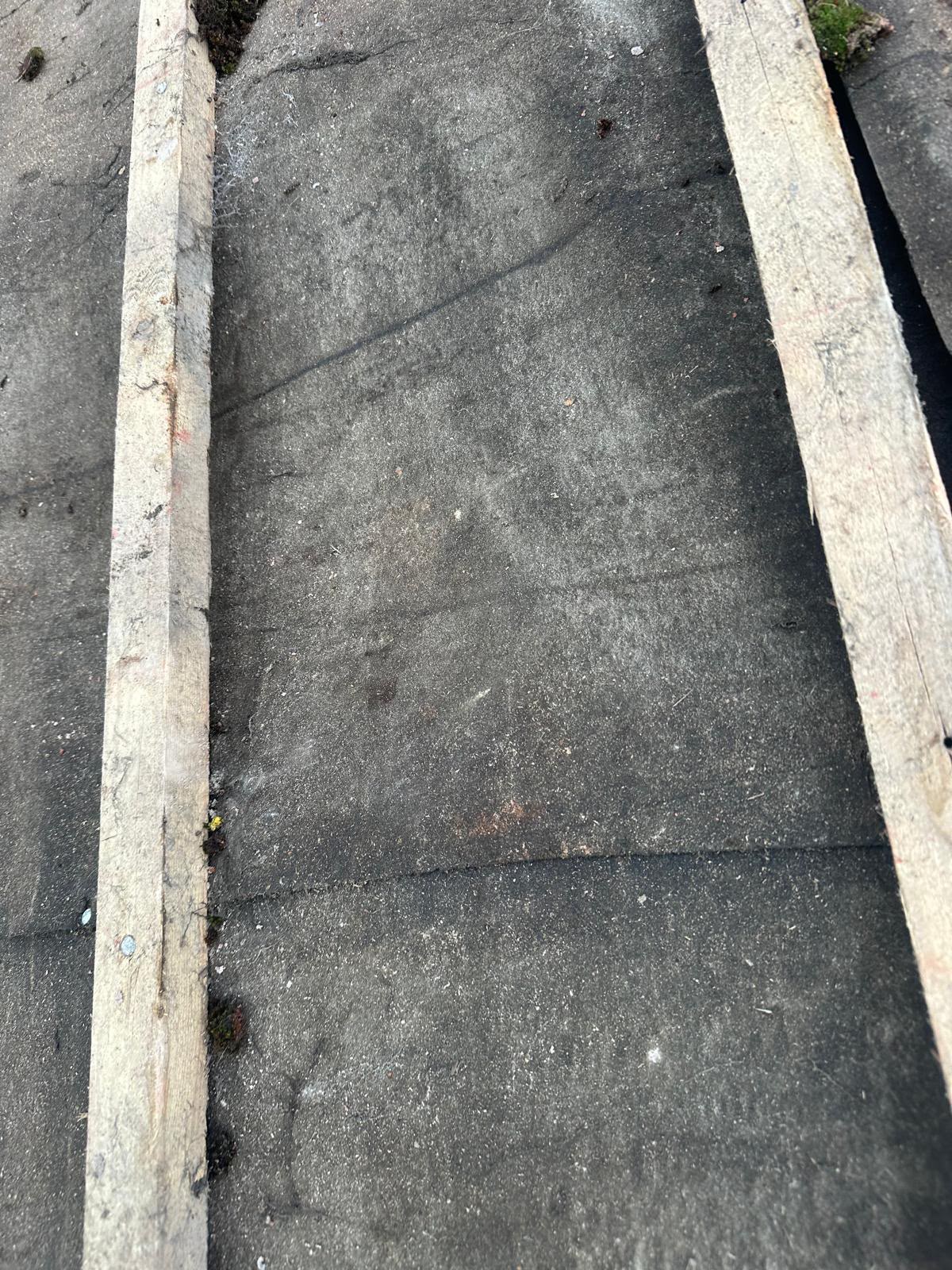 Old bituminous felt flat roof cracked and blistered before repair
