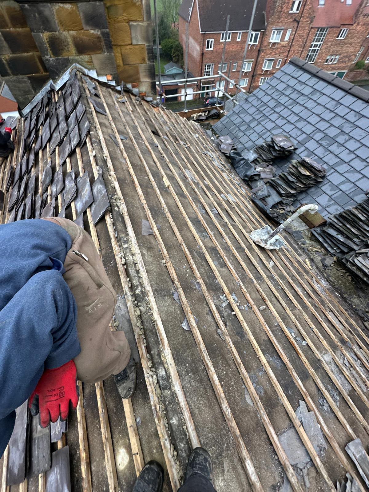 Old slate roof stripped back to the original timber battens during a re-roof